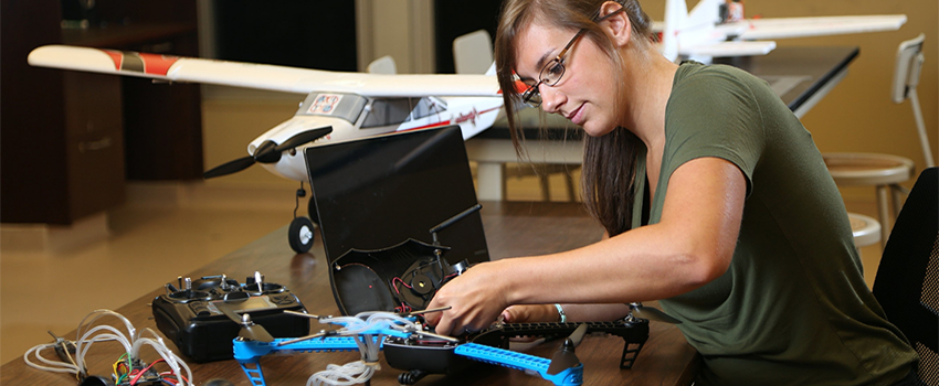 Female student working on drone